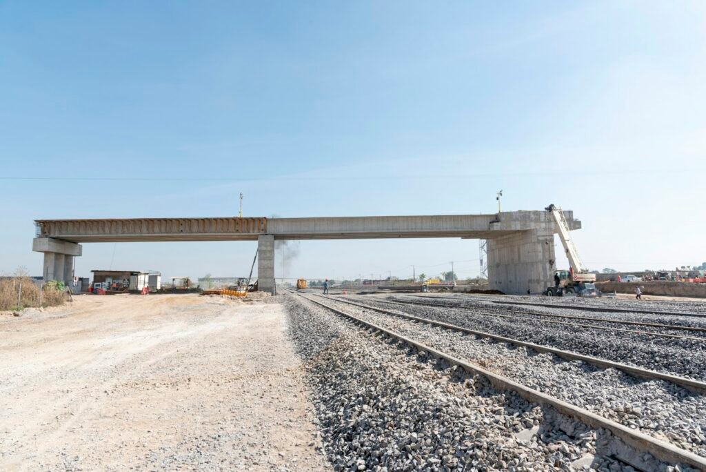 Concrete overpass bridge over rail tracks